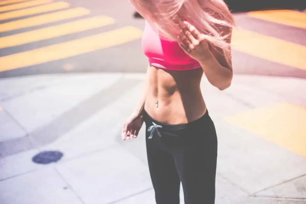 Woman with toned stomach after LA-EMS Body Sculpting Treatment Sands End